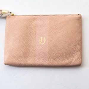 Pebble grain leather pouch bag with letter D by G.I.L.I.